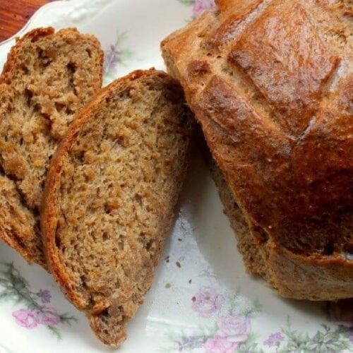 Slices of golden brown rye bread on a platter.