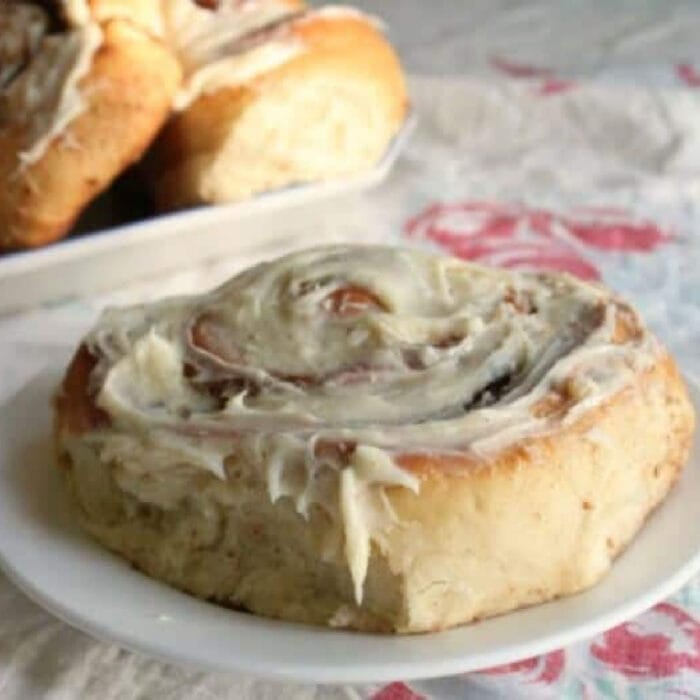 Large cinnamon roll on a plate.