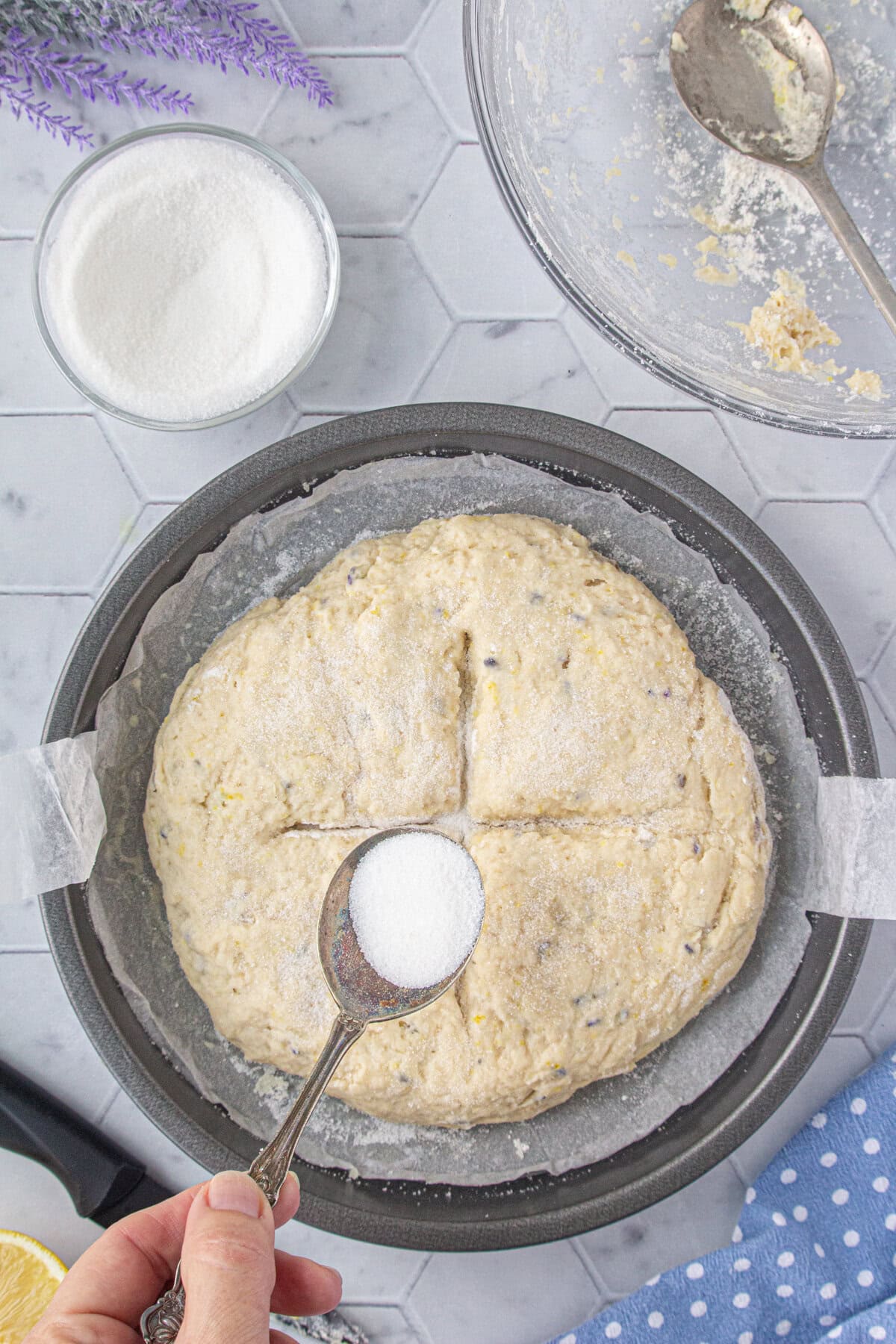 Unbaked round loaf in a cake pan.