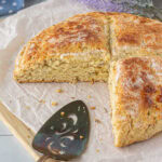 A round of lemon lavender soda bread that's been cut.