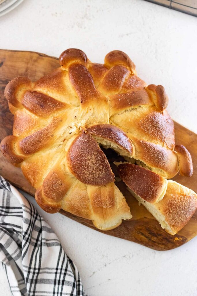 View of the loaf from the top with a wedge being removed.