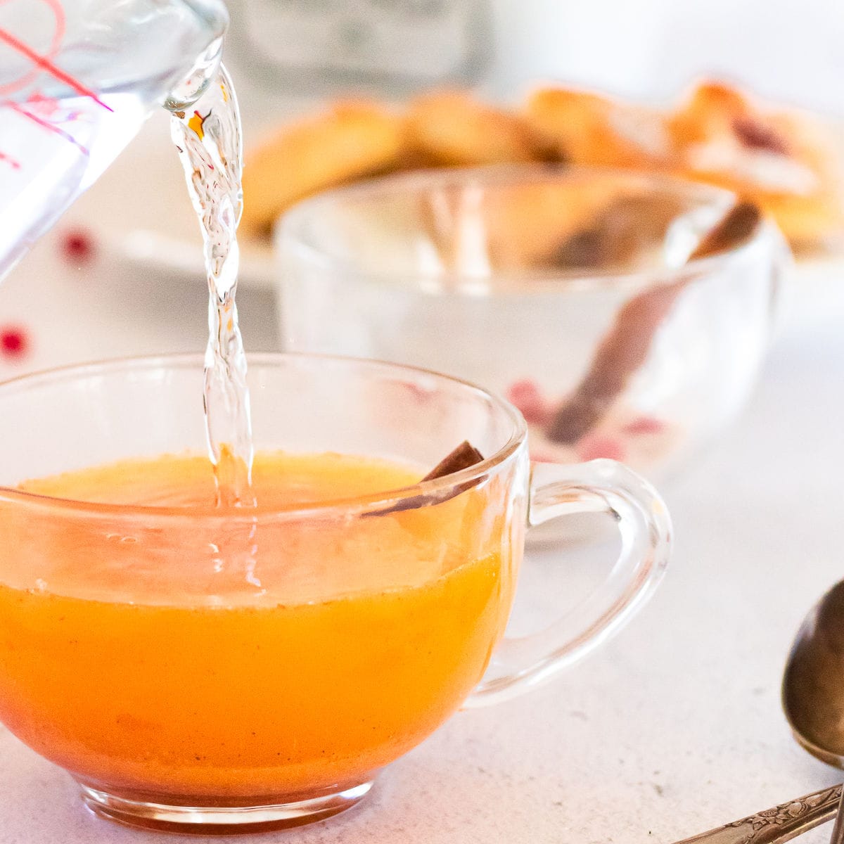 Boiling water being poured into tea mix.