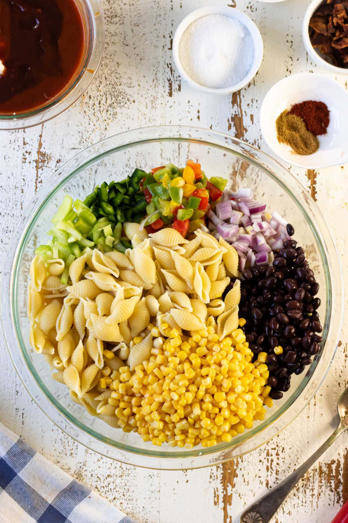 Ingredients for bbq macaroni salad in a bowl.