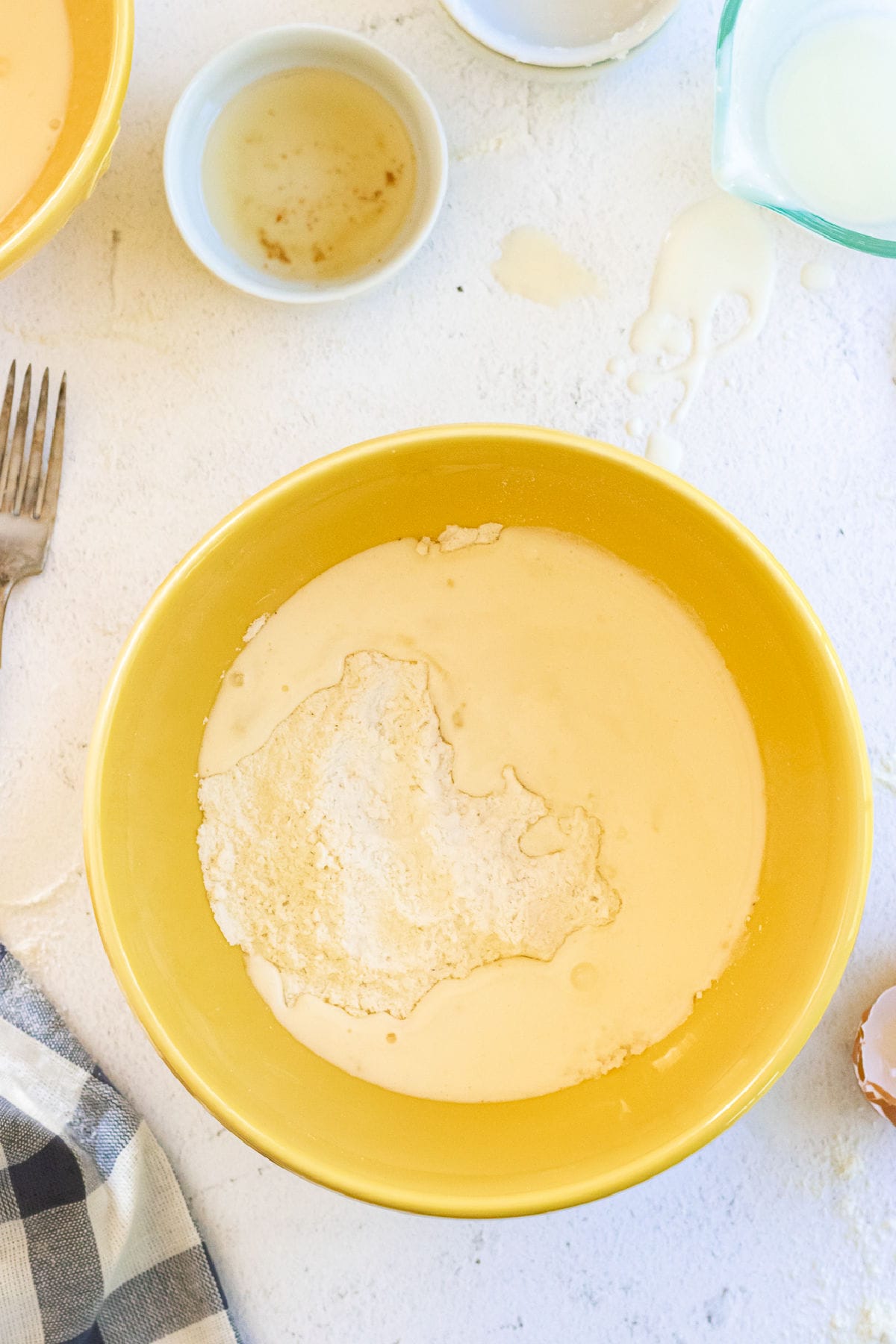 Overhead view of a bowl with dry ingredients mixed together.