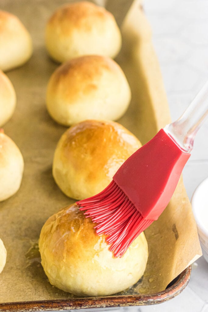 FInished rolls being brushed with butter.