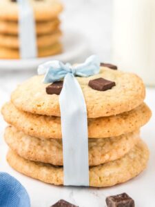 A stack of cookies tied with a blue ribbon.