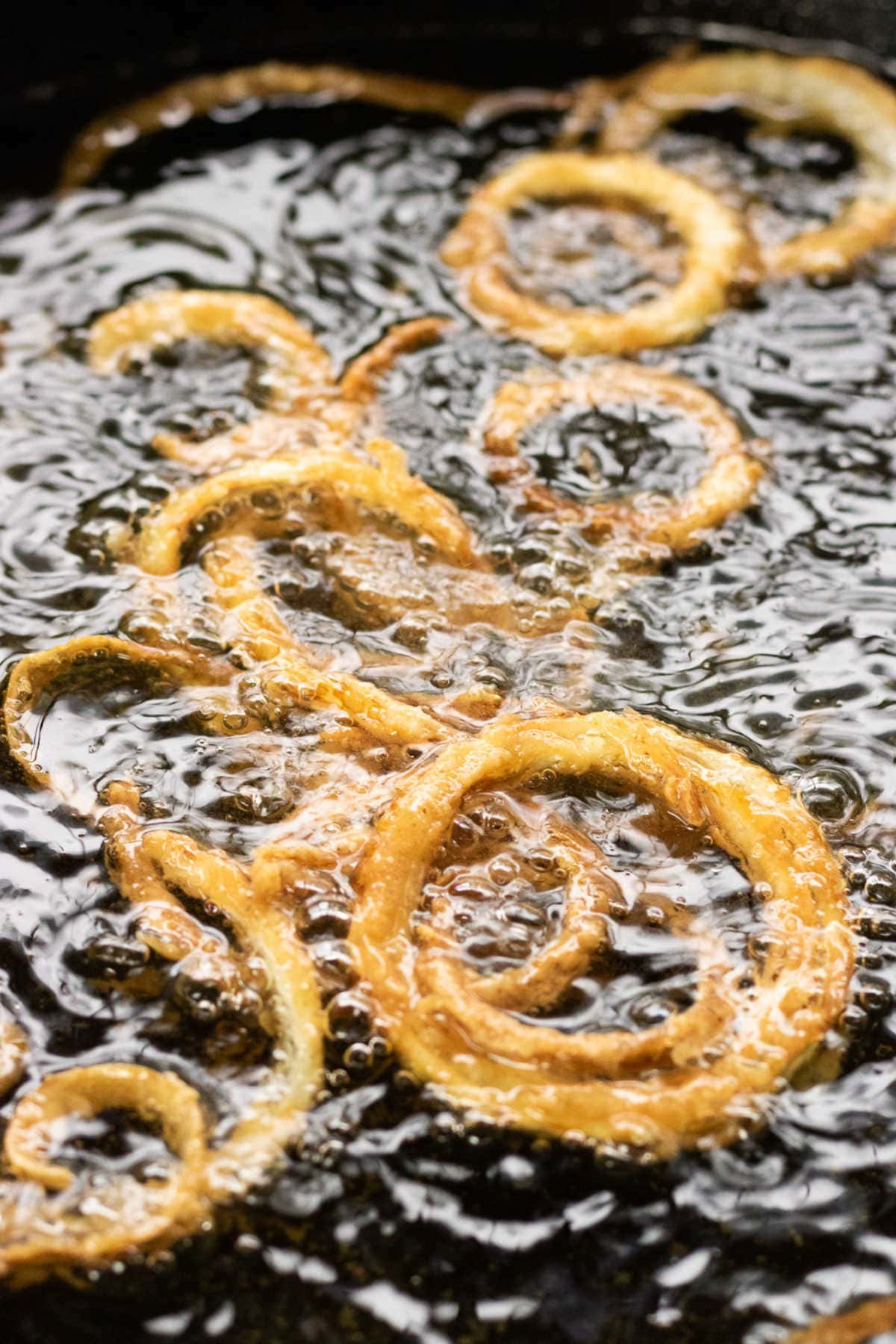 Onions frying in hot oil.