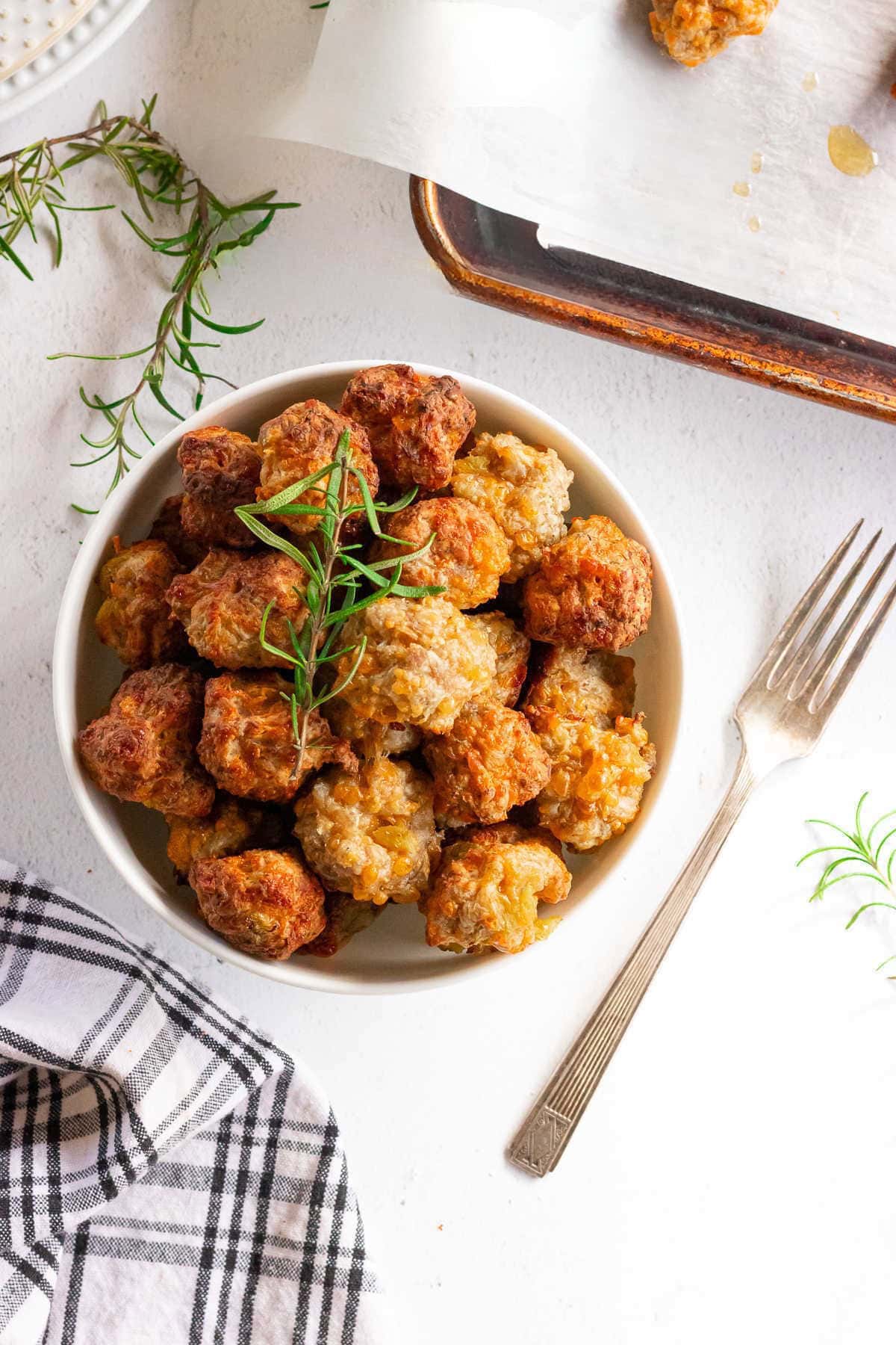 Overhead view of cream cheese sausage balls in a dish.