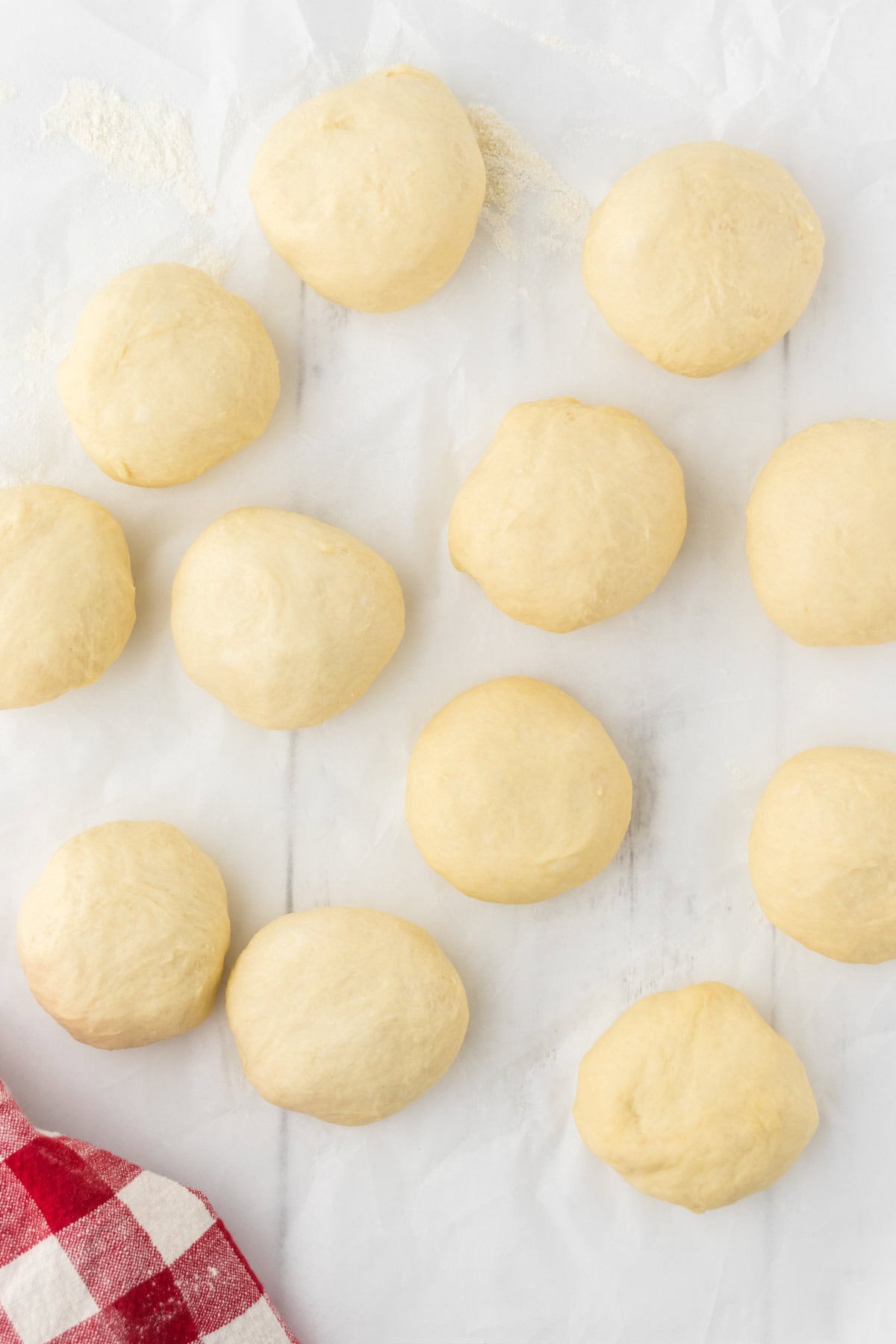 Dough is separated into equal pieces and formed into buns.