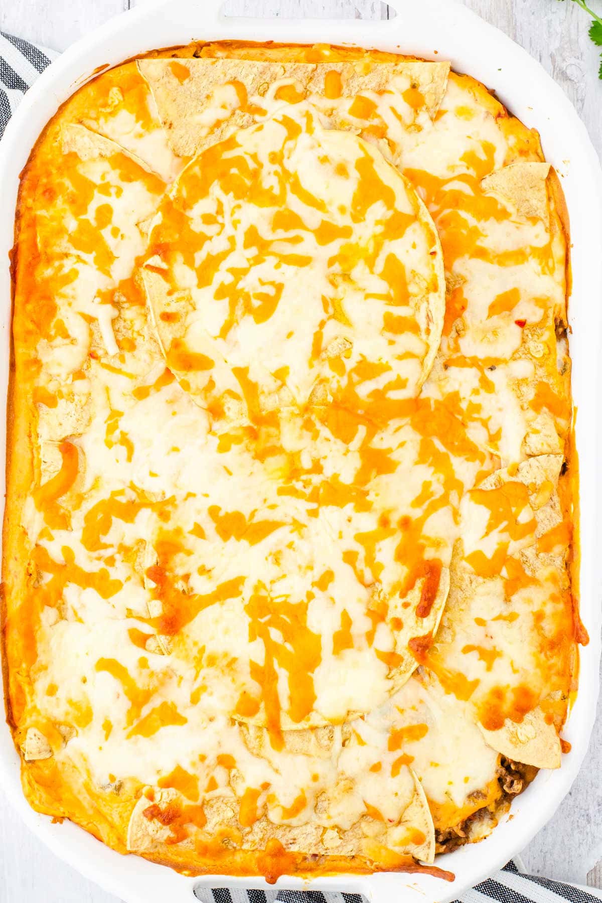 Casserole covered with cheese.