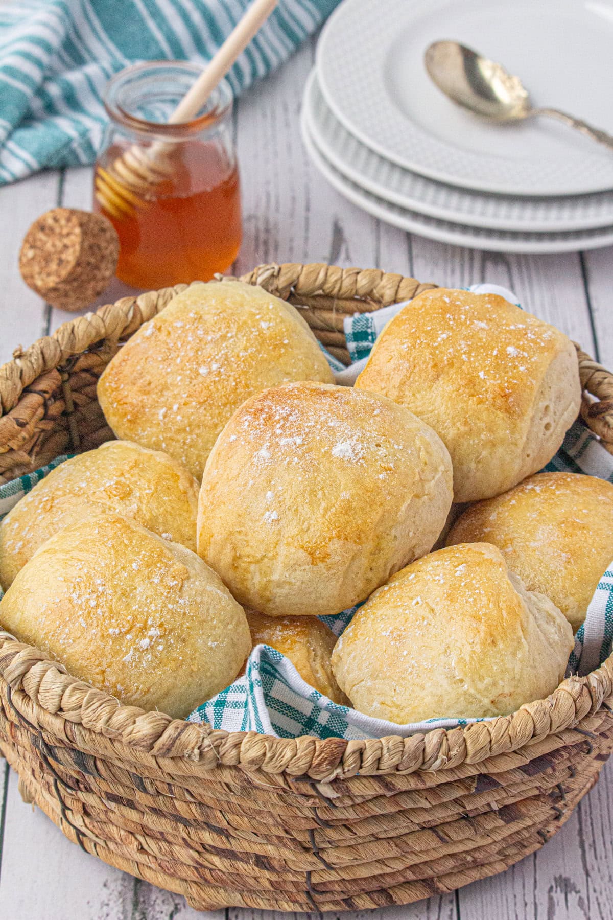 A basket of buttermilk dinner rolls in the table.