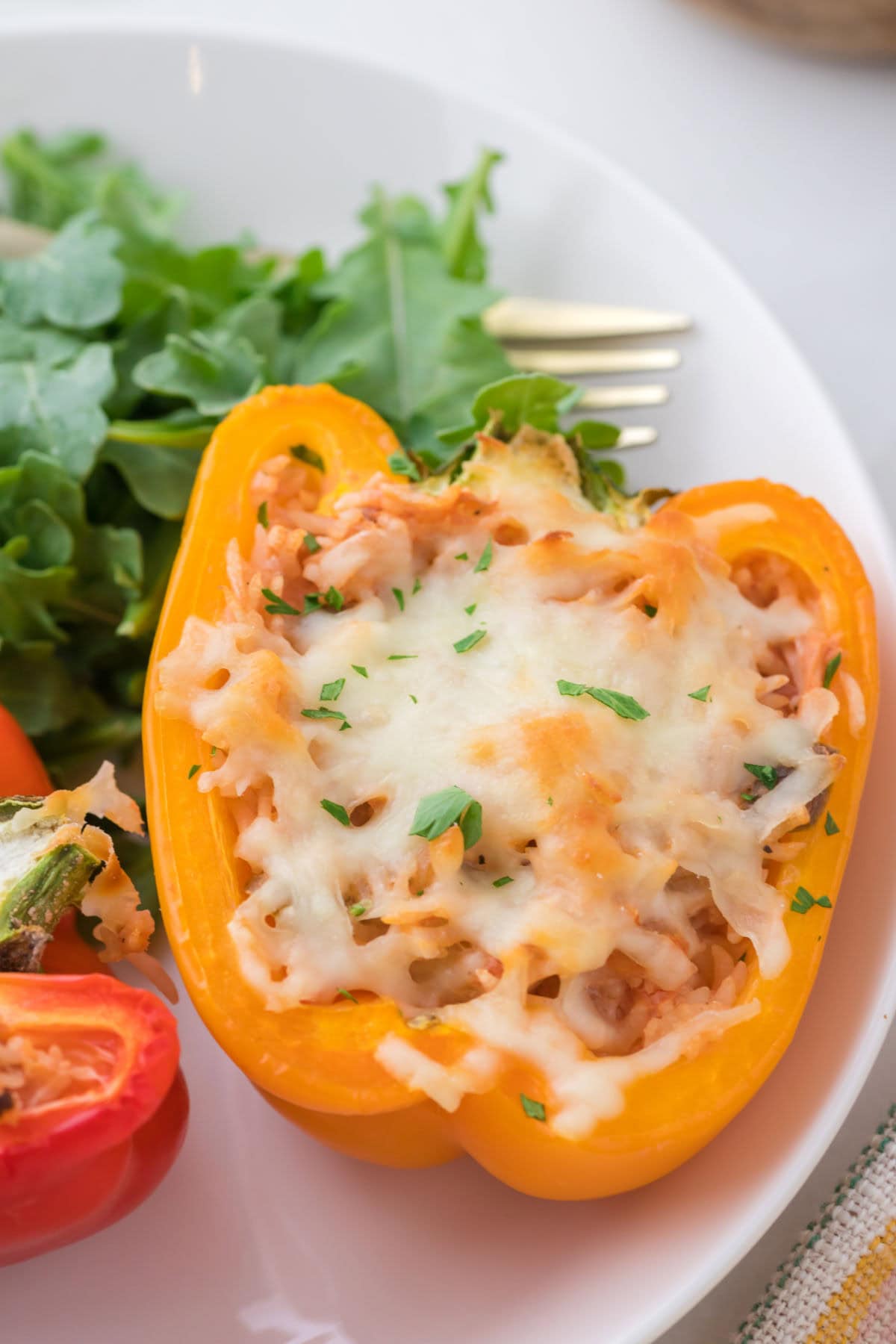 Close up of stuffed peppers on a plate.