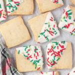 Overhead view of decorated holiday Hawaiian shortbread cookies on a tray.