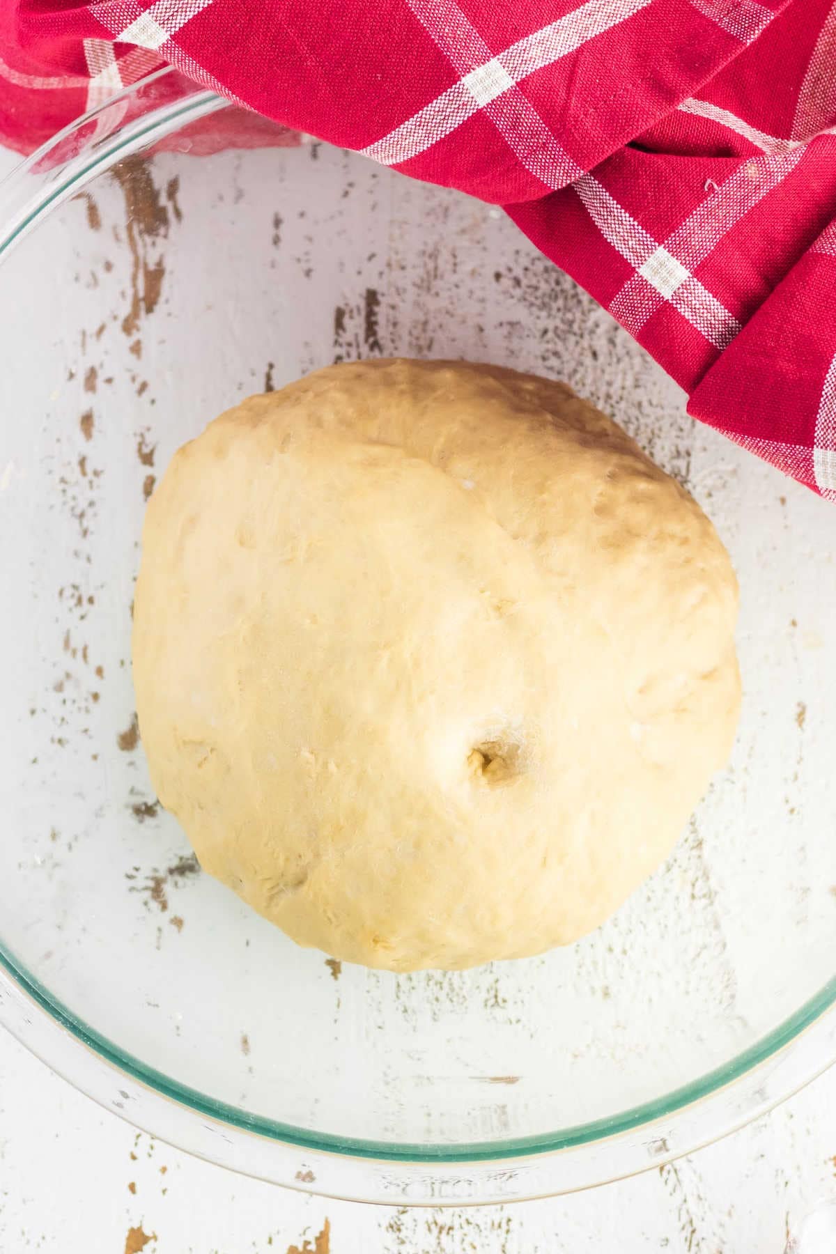 Ball of dough has risen until it has doubled in size.