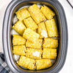 Overhead view of corn on the cob in a crockpot.
