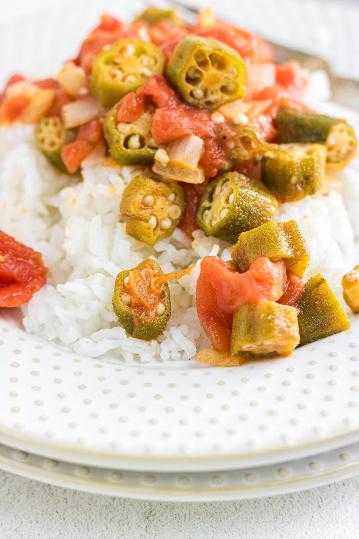 A close-up view of Southern okra and tomatoes over rice.