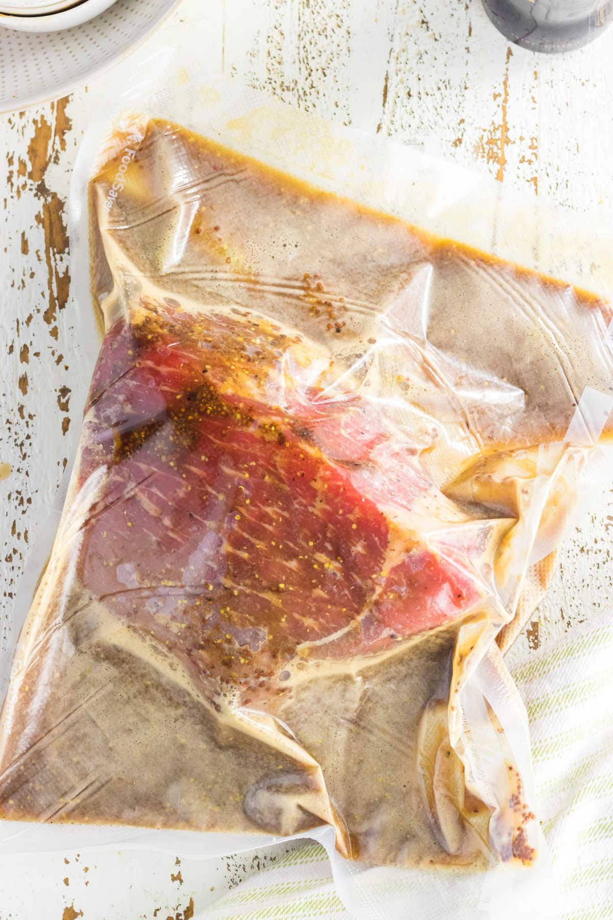 The bottom round roast and marinade in a plastic bag.