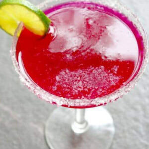 Overhead view of a bright pink prickly pear margarita.