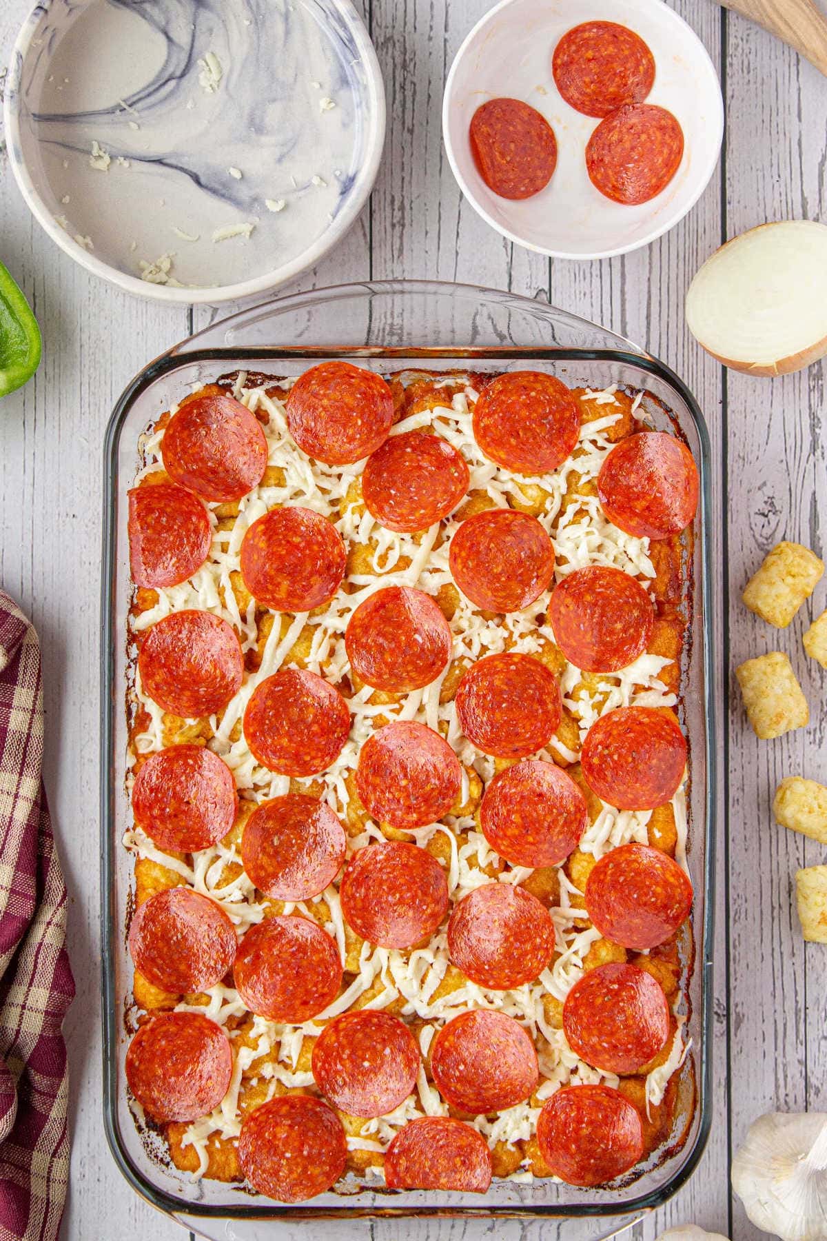 Finished casserole with cheese and pepperoni on top.
