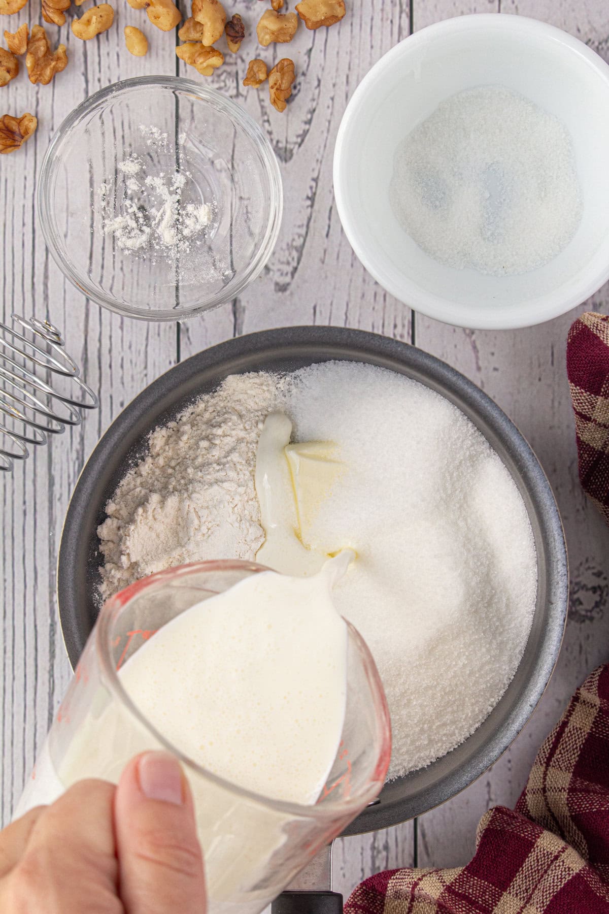 Cream being added to butter sugar mixture.