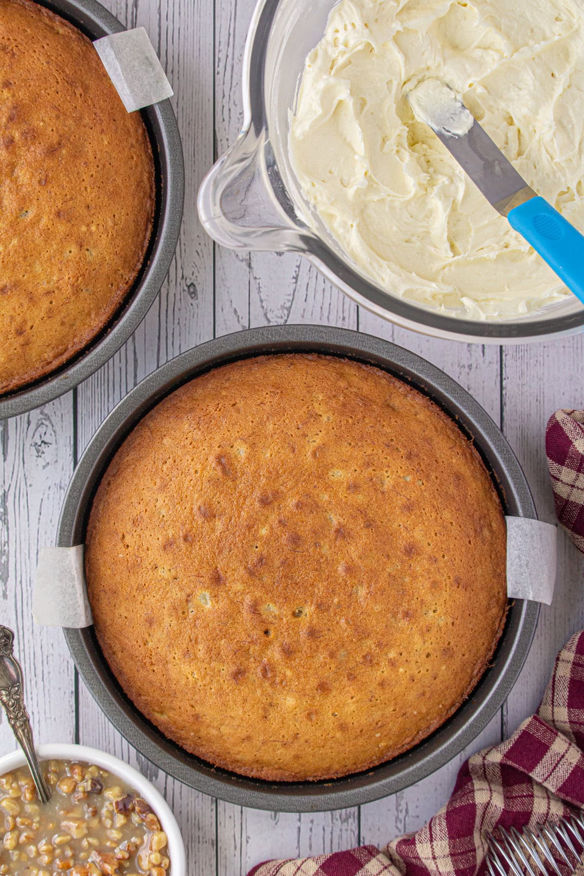 Baked cake layers in pans.