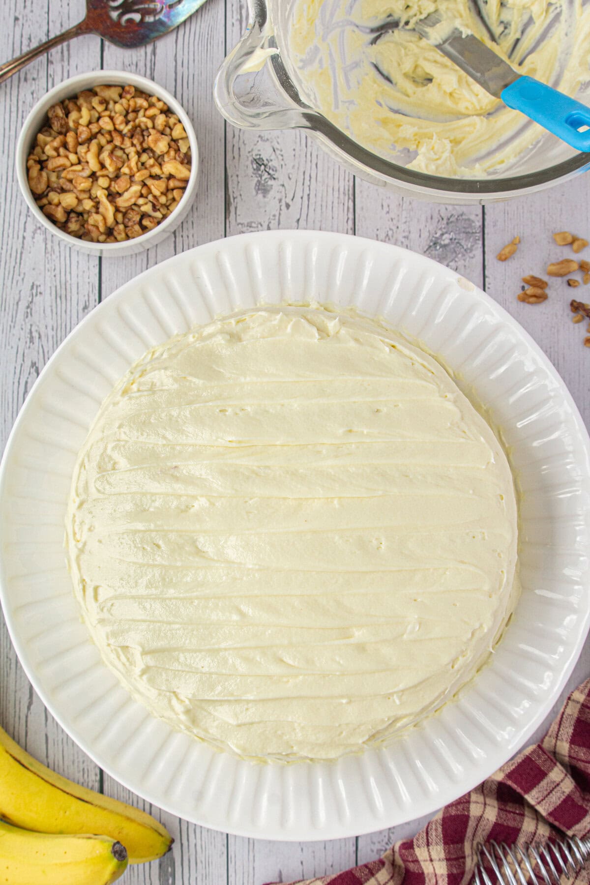 Banana walnut cake is finished and frosted.