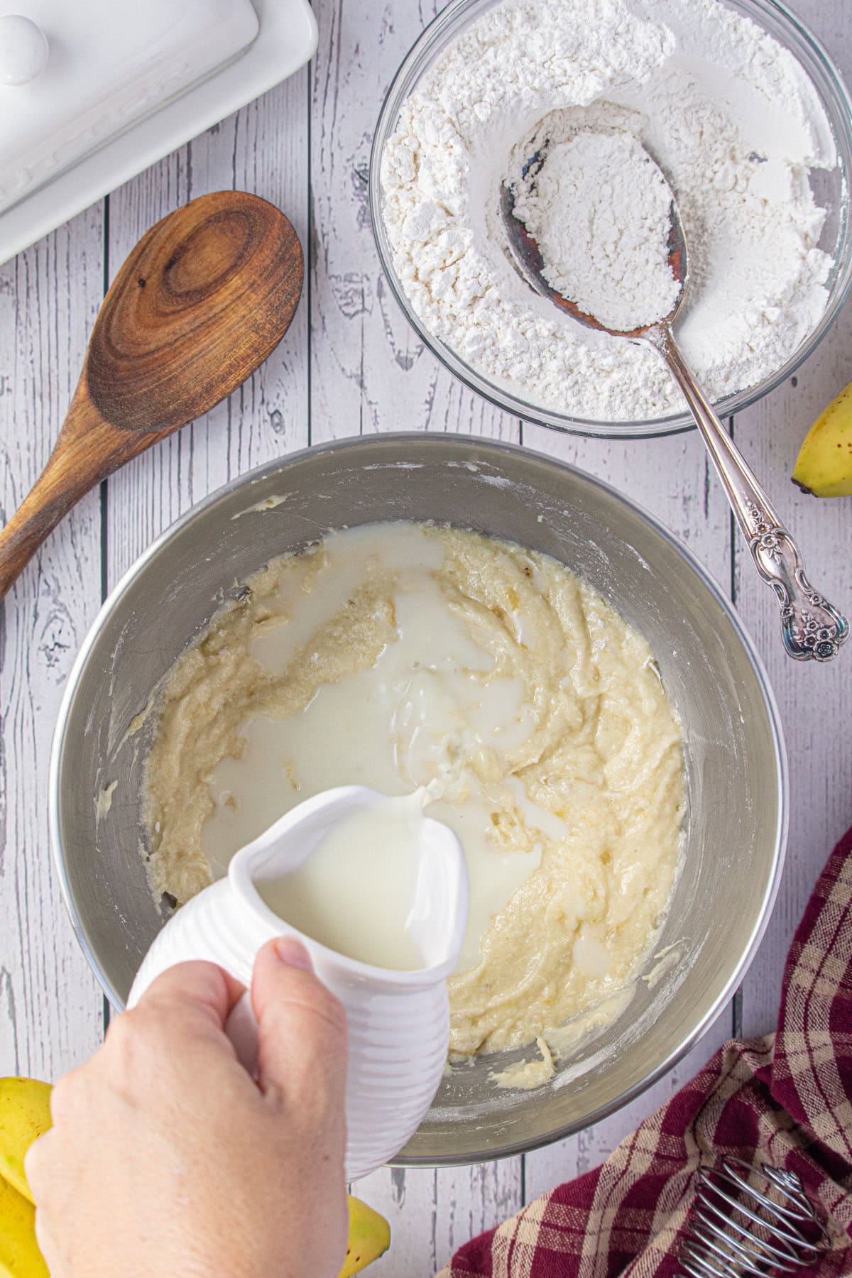 Buttermilk being added to batter alternately with flour.