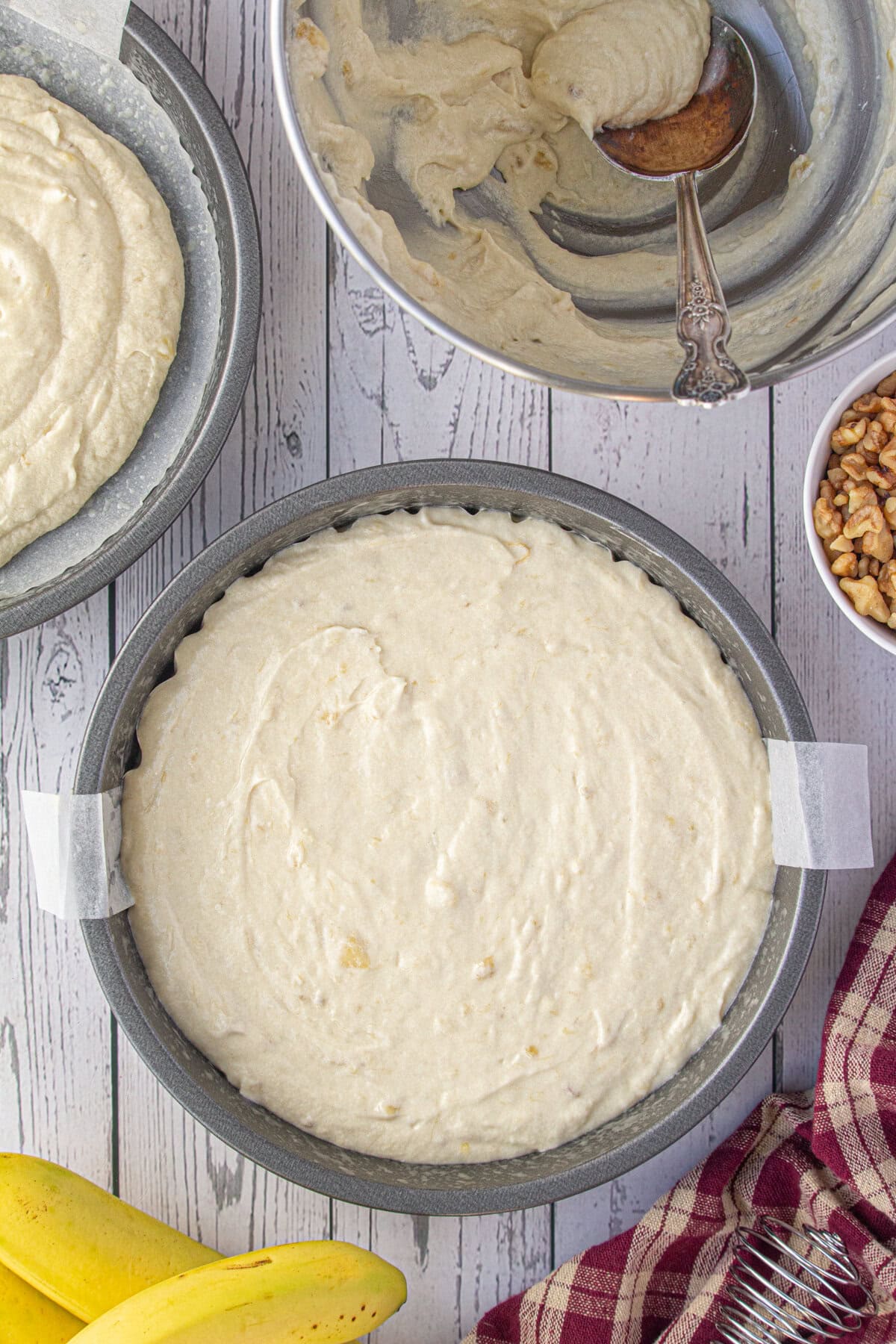 Batter in a cake pan ready to bake.