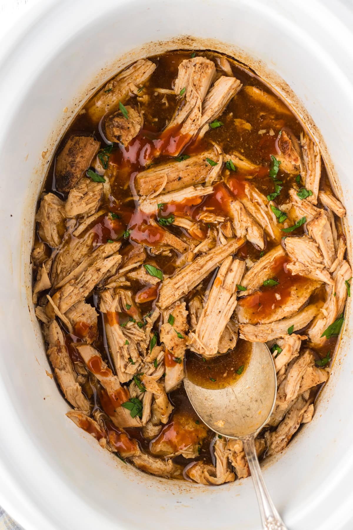 A slow cooker filled with Dr Pepper pulled pork.