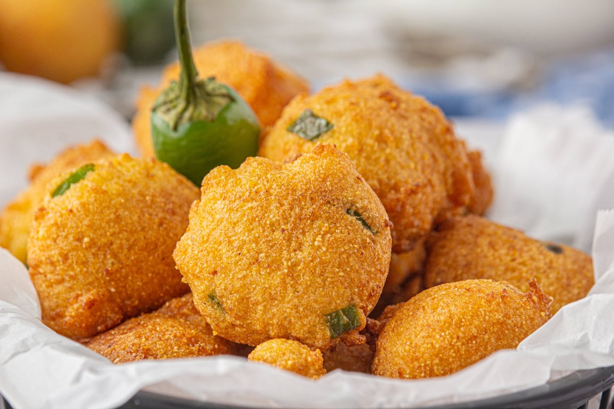 An up-close view of Southern hushpuppies in a basket.