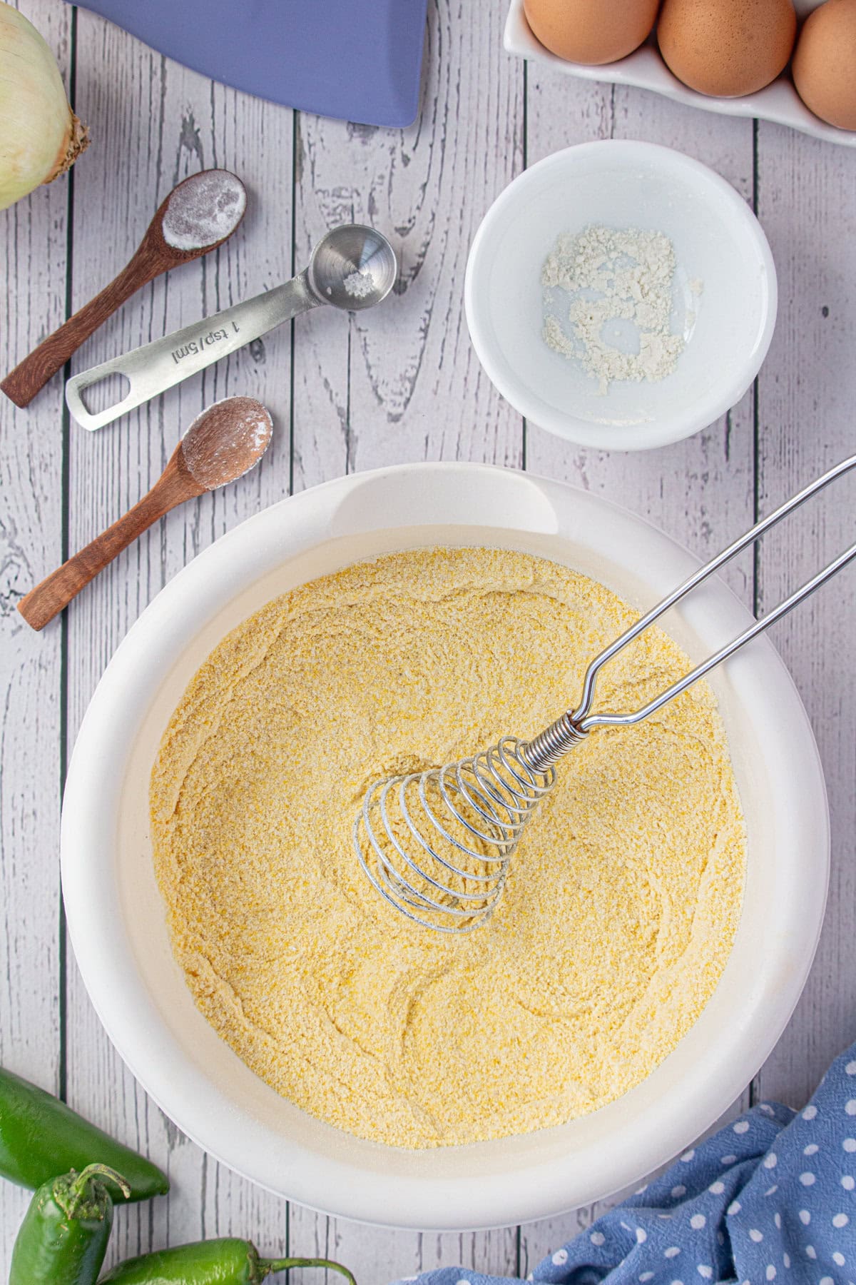 Whisking the dry ingredients together.