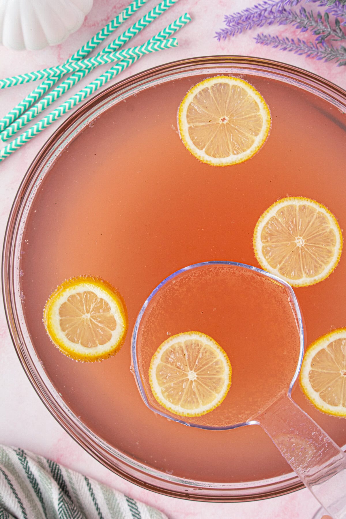 Punch bowl with lemon slices floating in the punch.