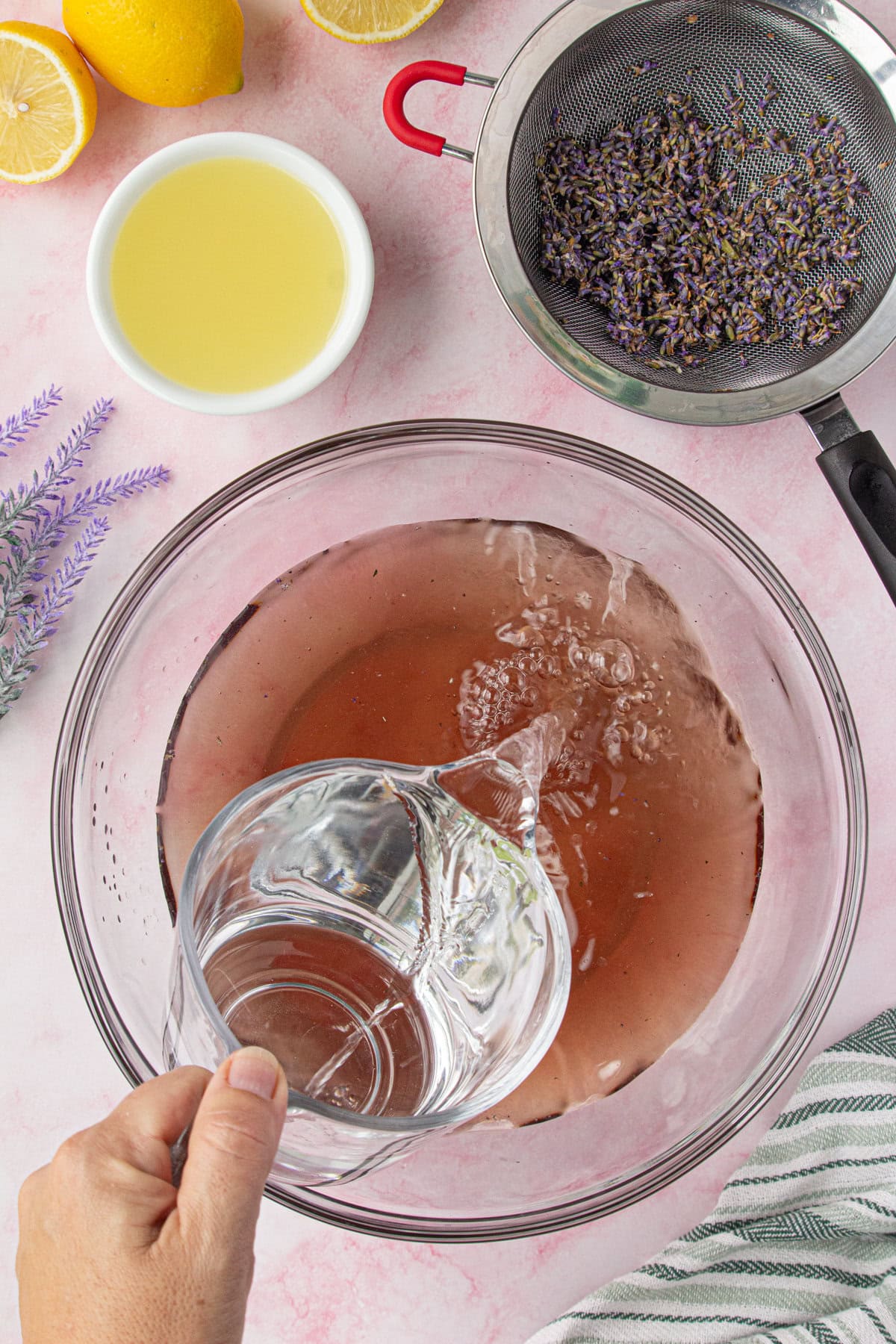 Water being added to the punch bowl.