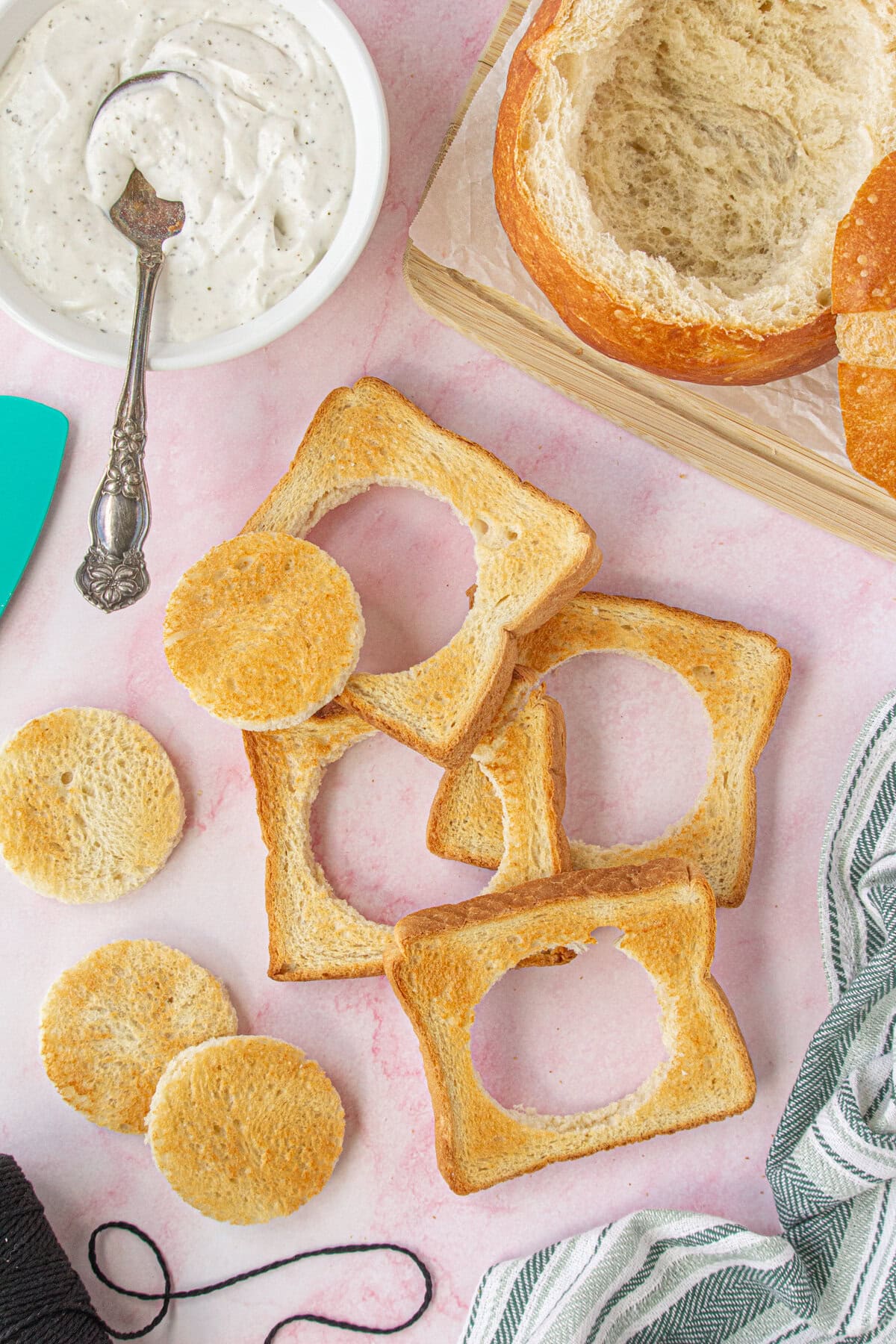 Overhead view of the toast cut into circles for the wheels.