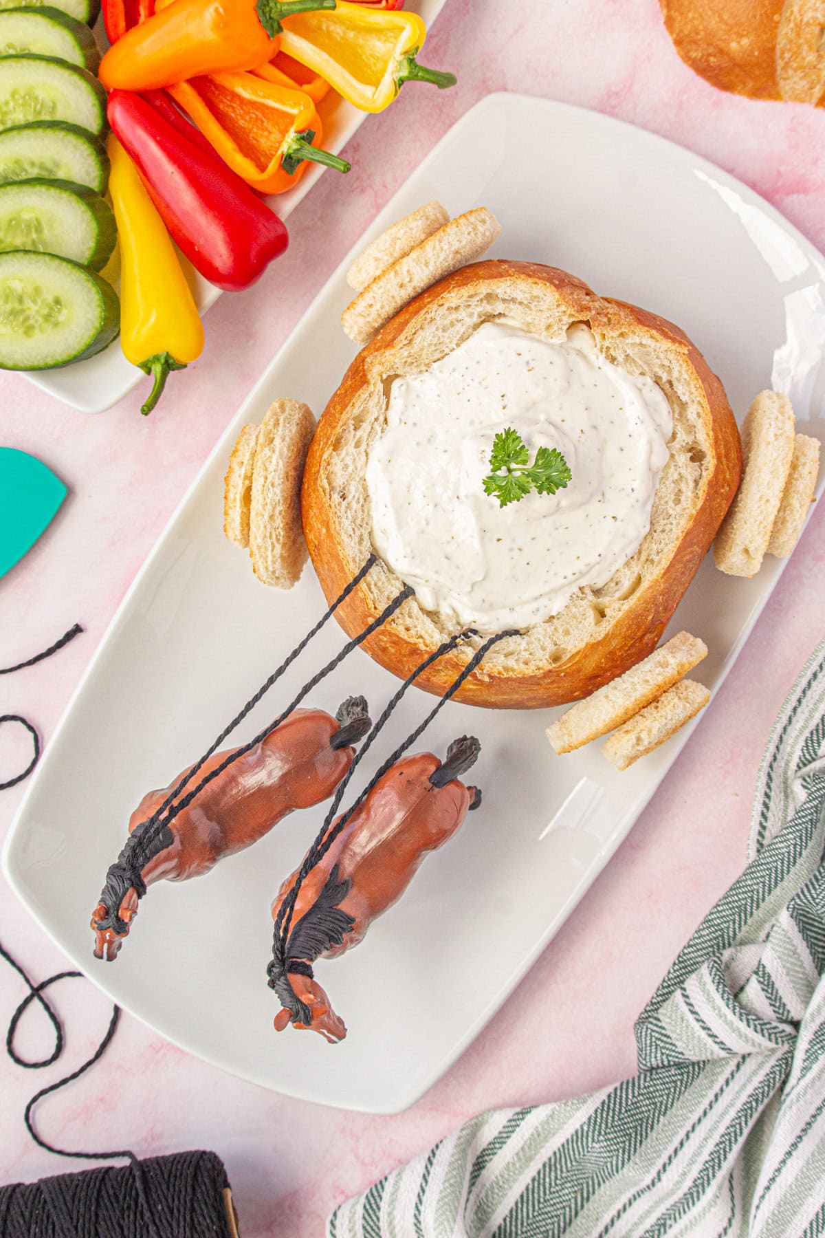 Overhead view of the dip in the bread bowl and the horses attached.