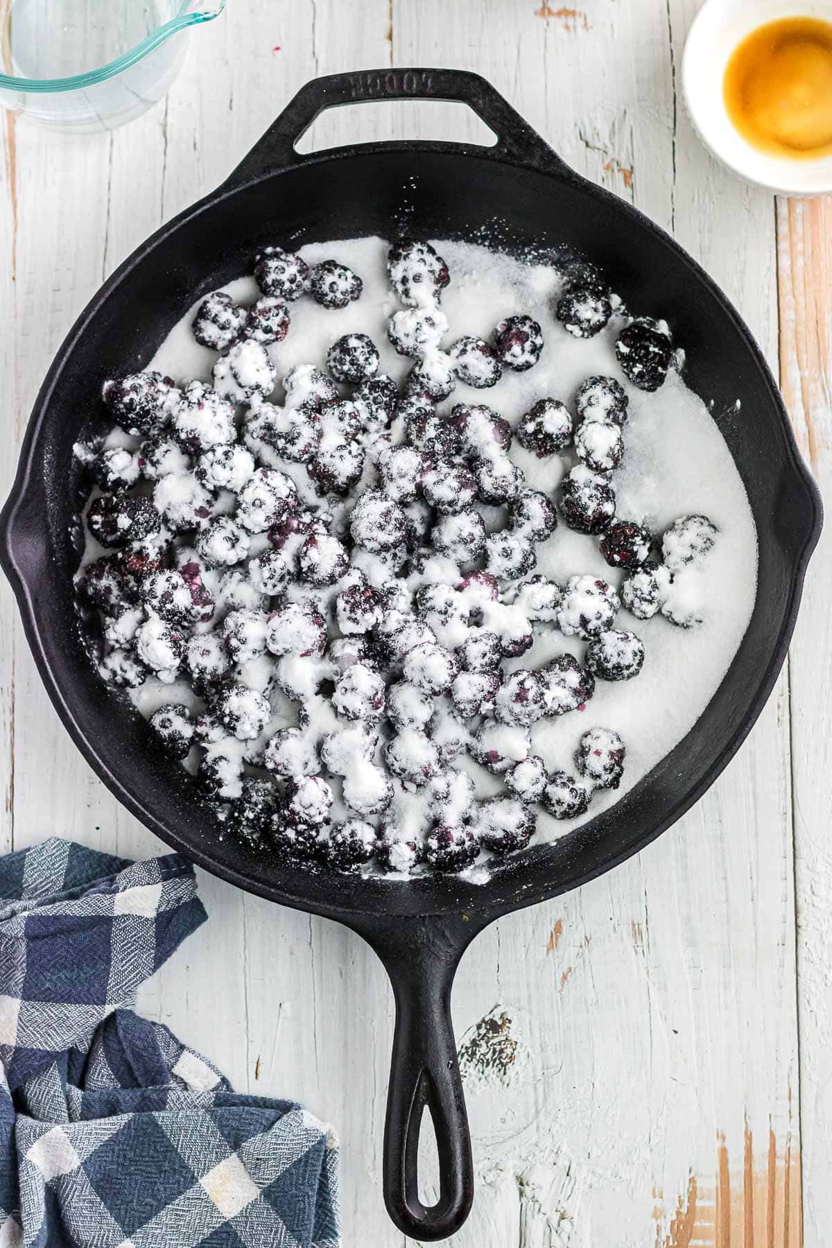 The blackberries, sugar, and starch combined in a skillet.