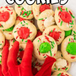 Overview of red and green filling thumbrint christmas cookies with a title text overlay for Pinterest.