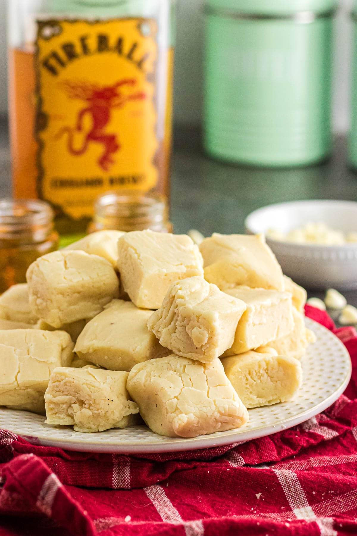 A close-up photo of Fireball fudge stacked on a serving plate.