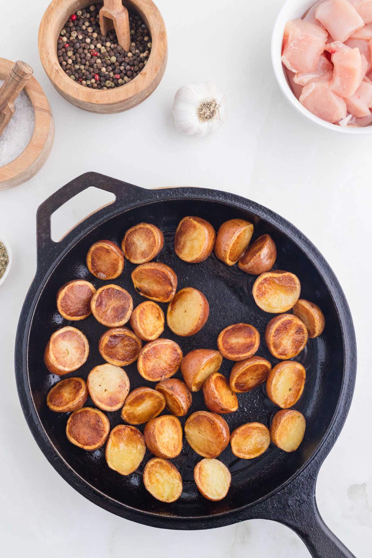 Cooking the potatoes in a skillet.