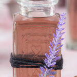 A jar of lavender syrup with title text overlay for Pinterest.