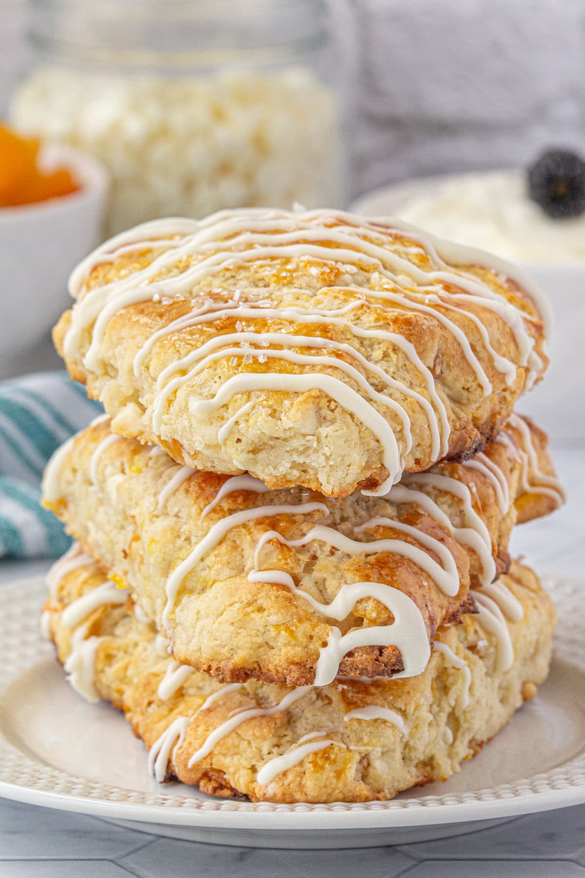 A stack of apricot white chocolate scones on a plate.