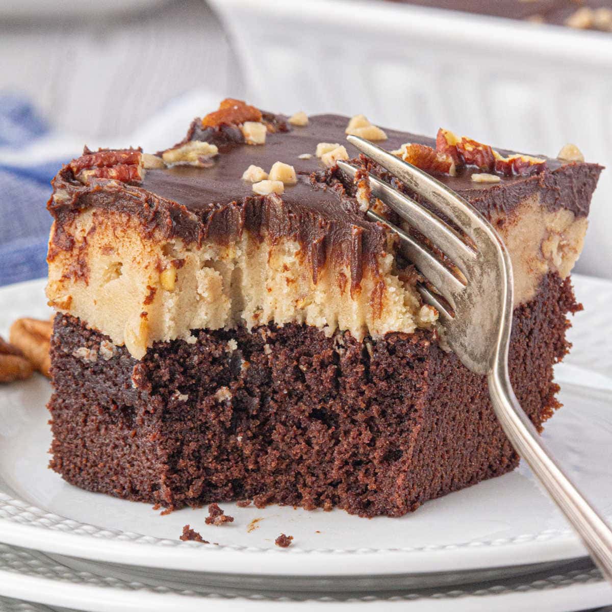 Closeup of a cookie dough brownie with a fork in it.