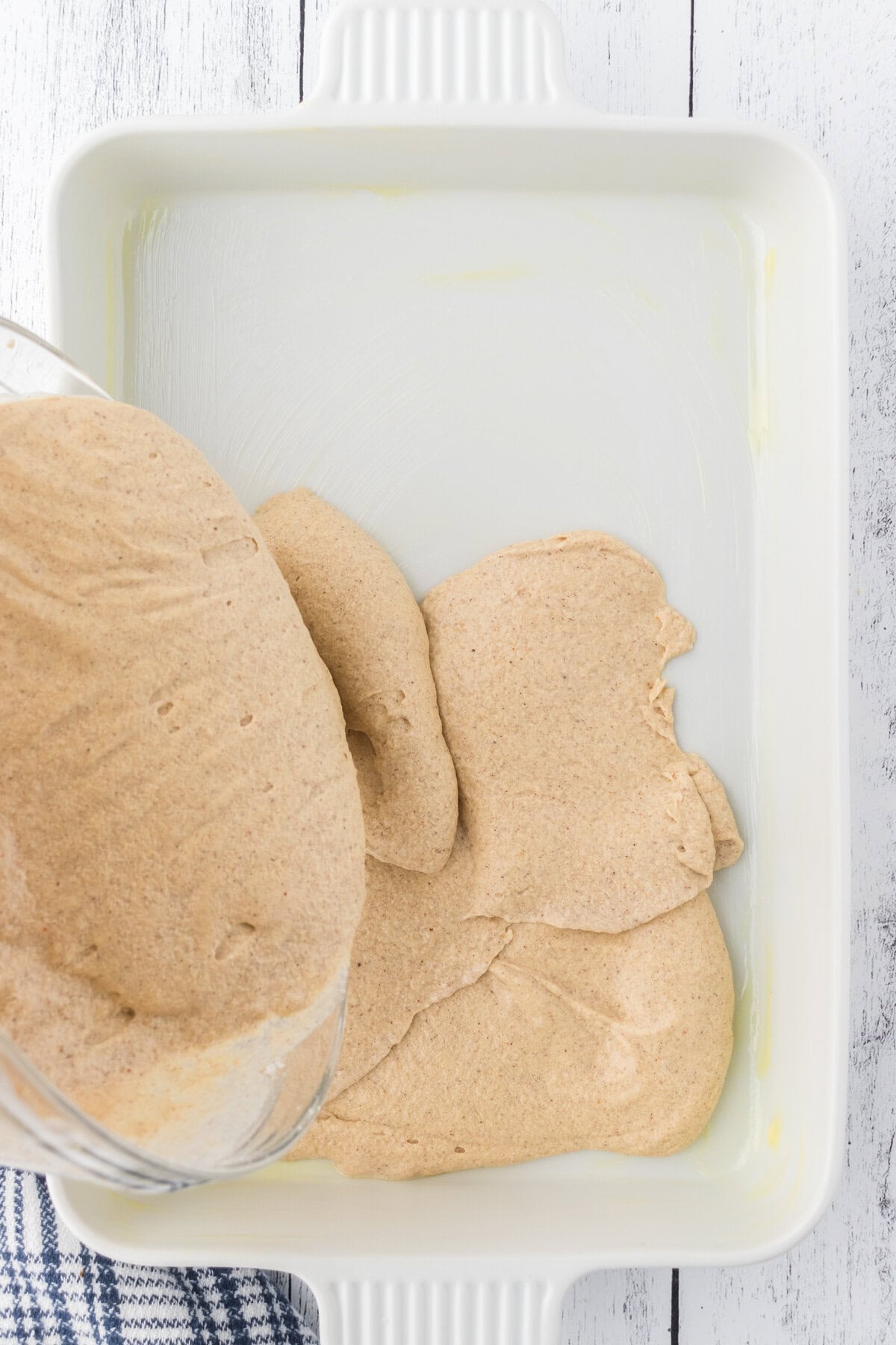 Batter being poured into the pan.