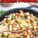 A wooden spoon serving country potatoes from a cast iron skillet with a title text overlay for Pinterest.