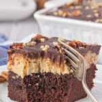 Closeup of a cookie dough brownie with a fork in it and a title text overlay for Pinterest.