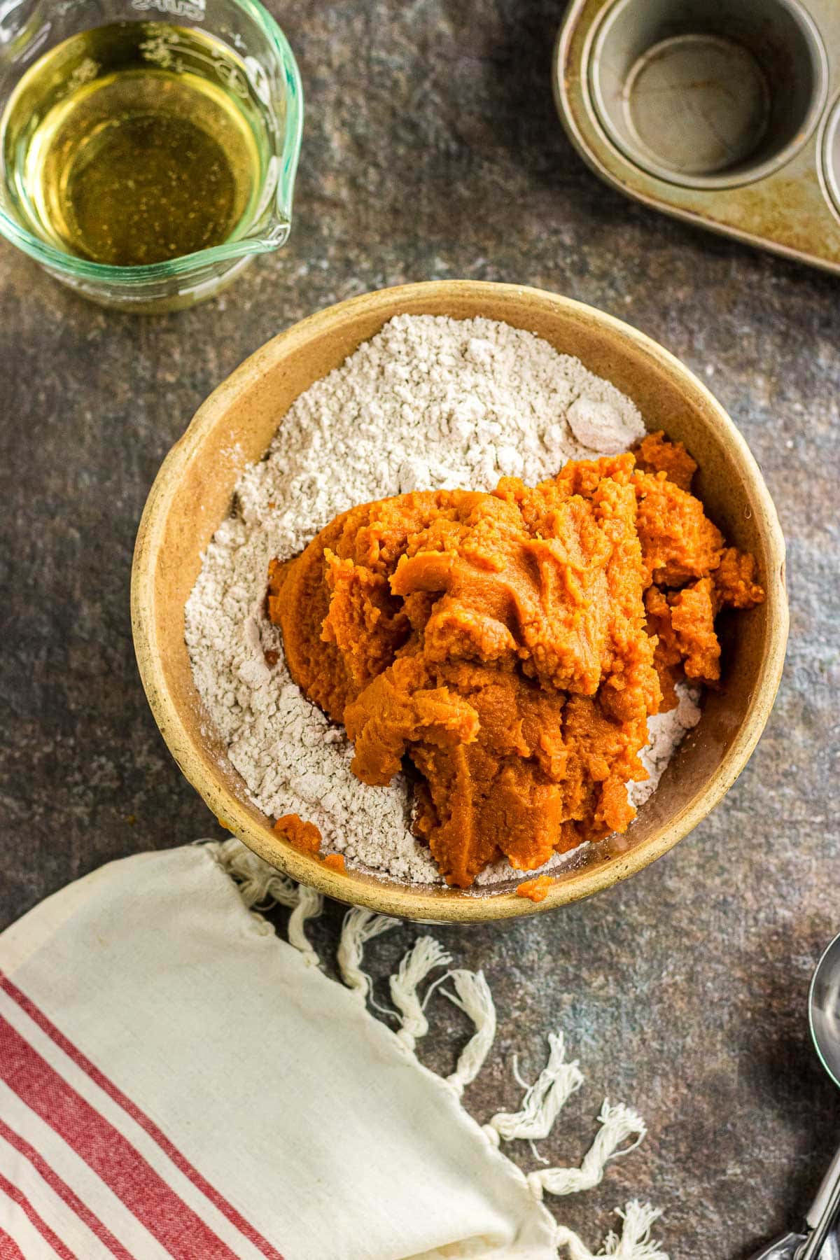 The pumpkin puree and cake mix in a bowl.