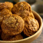 Close up of the pumpkin muffins in a rustic bowl.