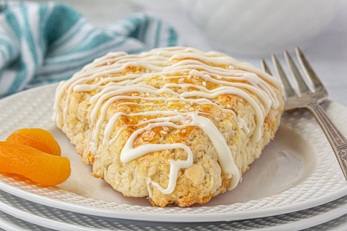 Closeup of a scone on a plate.