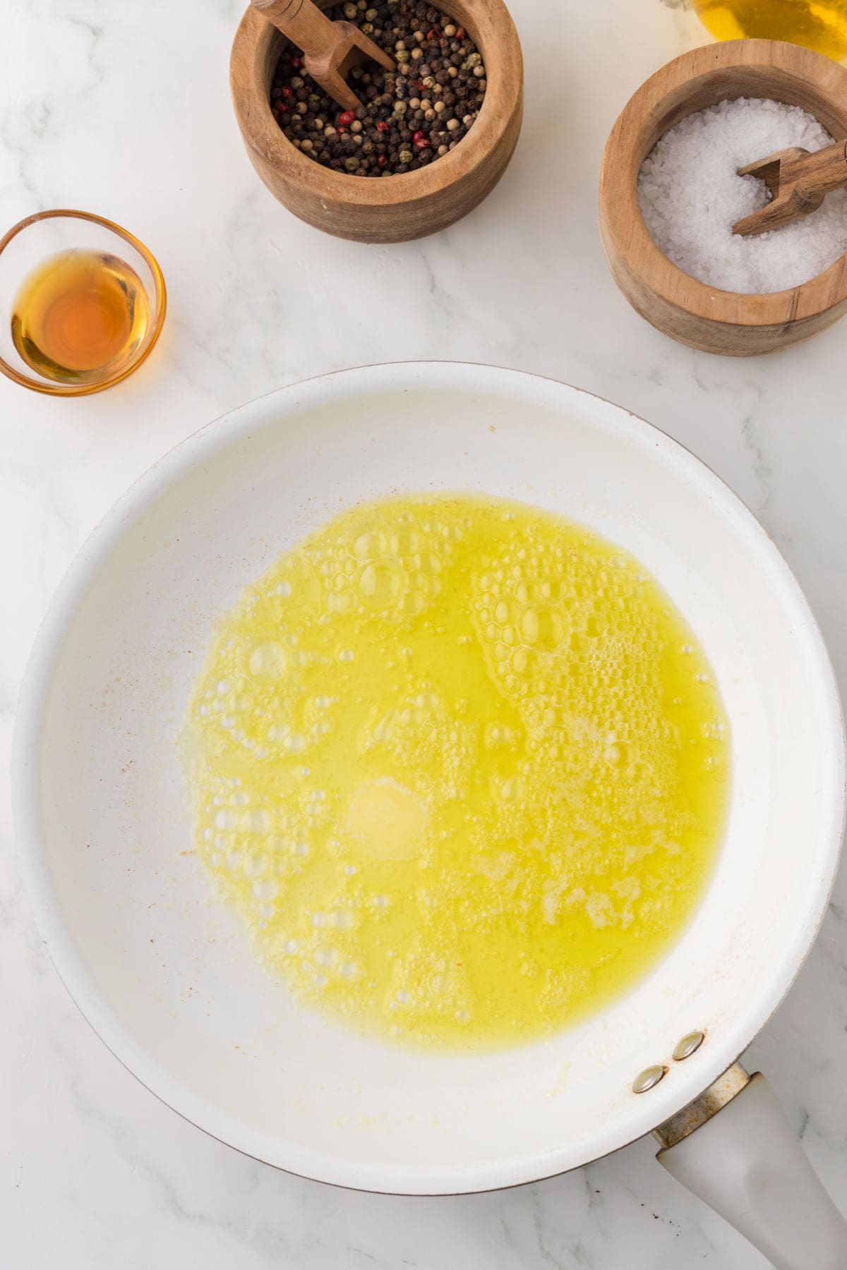 Butter melted with olive oil in a pan.