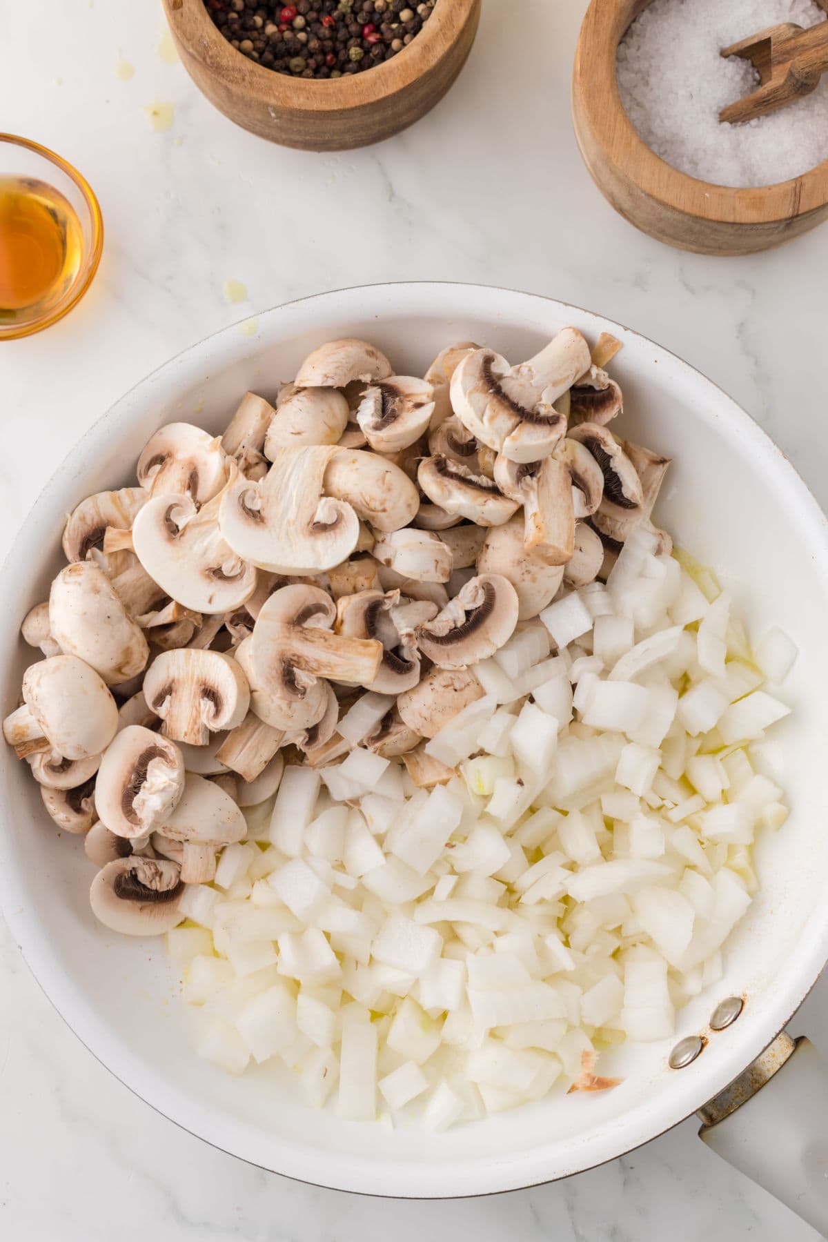 Mushrooms and onions being sauteed.